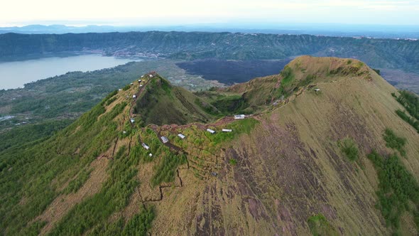 aerial of Mount Batur volcano crater rim at sunrise in Bali Indonesia alt