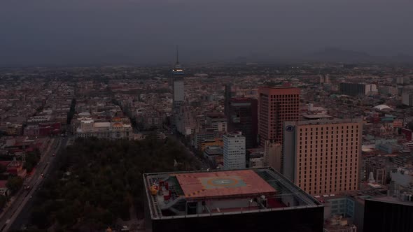 Drone Camera Flying Above Top of Skyscraper with Heliport alt