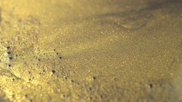 Rotation Of Gold Paint Particles