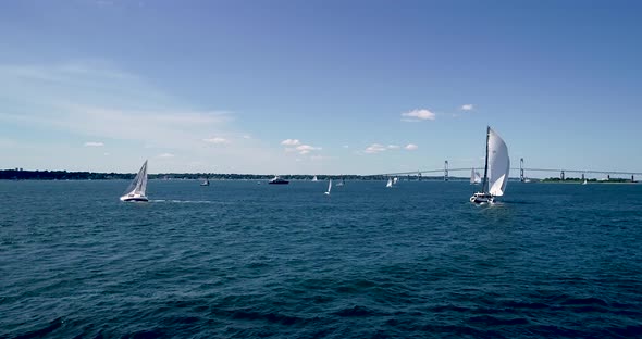 Sailboats entering and leaving Mt. Hope Bay in Newport Rhode Island as well as returning from Block alt