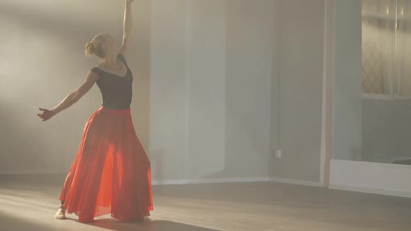 Wide Shot of Hardworking Slim Professional Ballerina in Scarlet Red Skirt Rehearsing Performance in alt