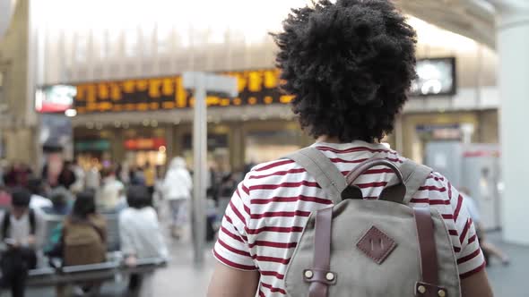 Man walking to the train at station, slow motion alt