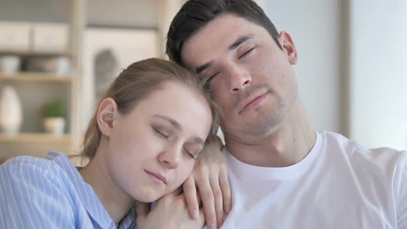 Close Up of Sleeping Young Couple on Couch alt