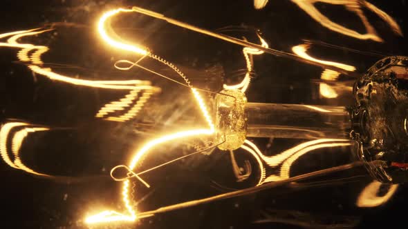 The Tungsten Filament in Classic Incandescent Glass Lamp Heats Up and Cools Down alt