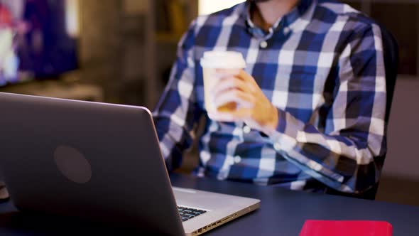 Young Businessman Working During Hours in His Home Office alt