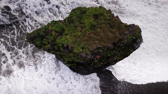 Drone Flight From Sea Stack In White Surf On Black Sand Beach alt