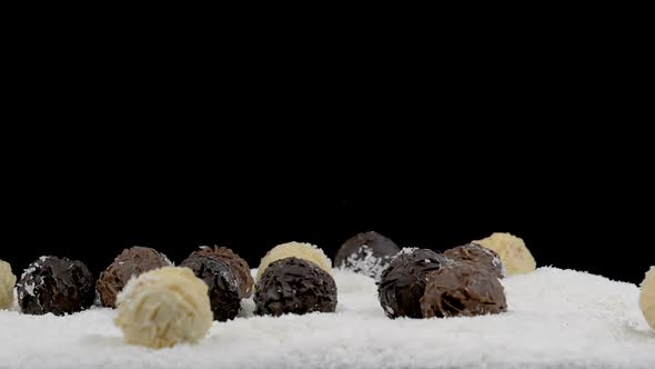 Chocolate Truffles Falling in Coconut Flakes 