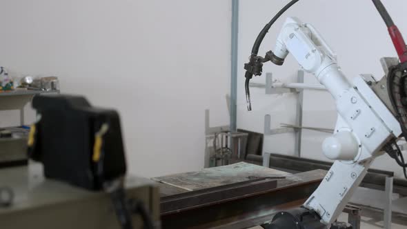 industrial 4.0 concept modern automated robot welding arm machine tool welds metal pipe alt