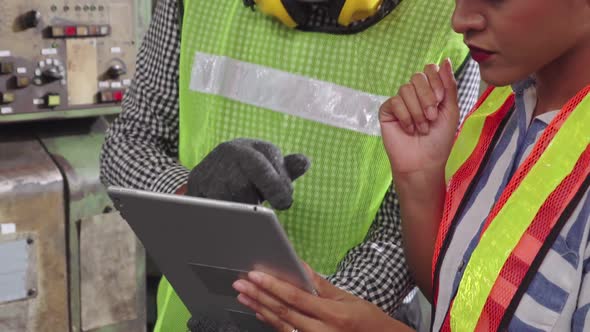 Group of Factory Workers Using Machine Equipment in Factory Workshop alt