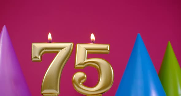 Burning Birthday Cake Candle Number 75