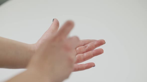 Closeup Disinfection of Female Hands with Sanitizer on Coronavirus Pandemic alt