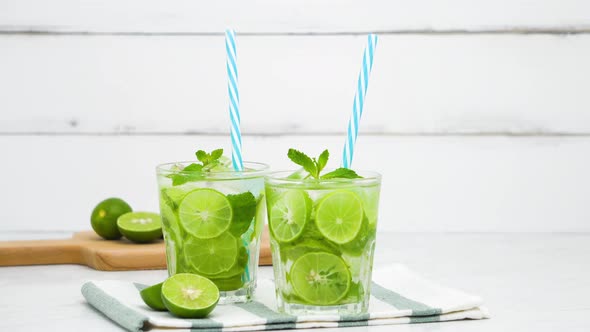 Refreshing Mojito cocktail drinks in the glasses