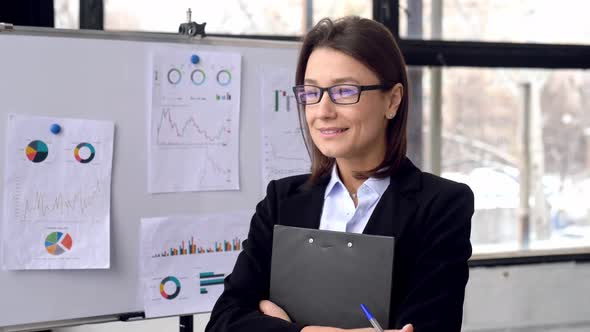 Portrait of Intelligent Elegant Caucasian Business Lady with Glasses Financial Top Manager or Mentor alt