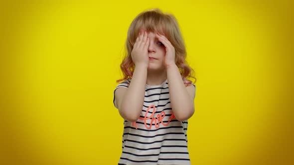 Nosy Curious Child Girl Closing Eyes with Hand and Spying Through Fingers Hiding Peeping Seeking alt