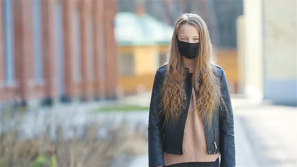 Girl Wearing a Mask Protect Against Coronavirus and Gripp