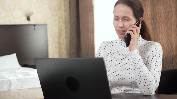 Professional Woman Works Using Computer Mobile Phone at Home alt