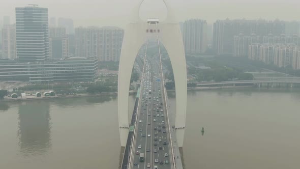 Liede Bridge on Pearl River. Guangzhou City in Smog, China. Aerial View alt