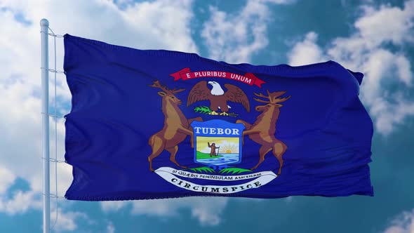 Flag of Michigan Waving in the Wind Against Deep Beautiful Clouds Sky alt
