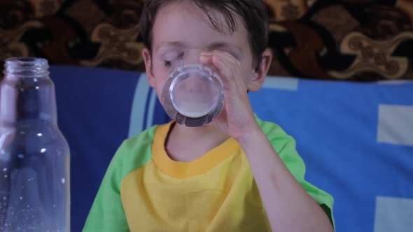 Little Boy Drinking Milk from His Cup 03