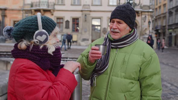Senior Couple Tourists Grandmother Grandfather Drinking From Thermos Enjoying Hot Drink Tea Coffee alt