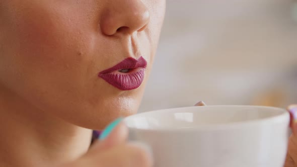 Close Up of Holding a Cup of Hot Tea alt