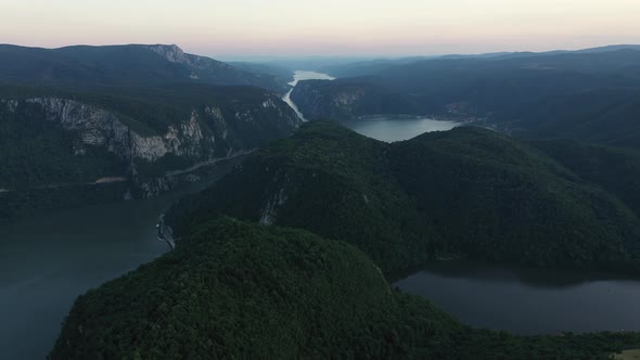 Aerial Shot of Beautiful Landscape on Danuba River in Dusk and Carpathian Mountains Green Woods