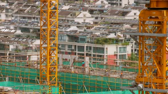Yellow Crane and Residential Building Under Construction in China