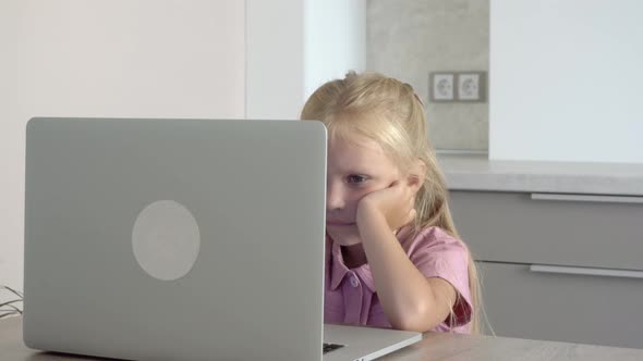 Child at home at the computer
