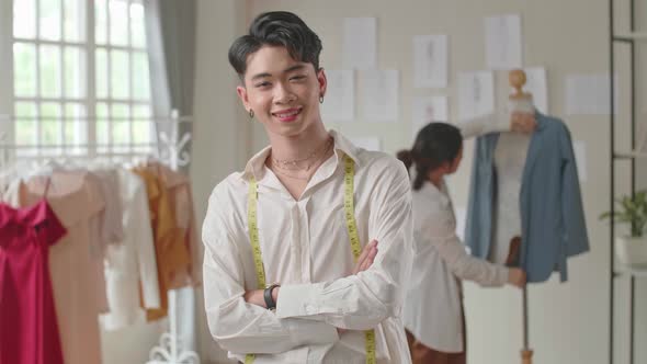 Young Asian Man Dressmaker Smiling alt