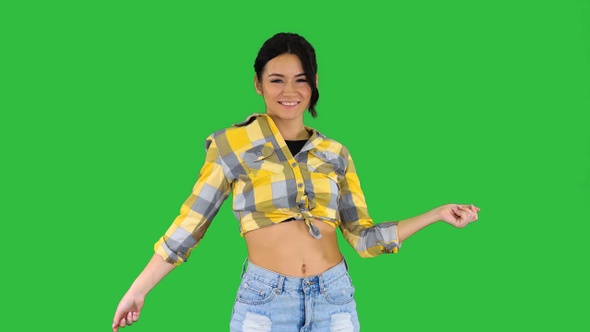 Girl in Square Shirt and Jeans Shorts Sneakers, Dancing alt