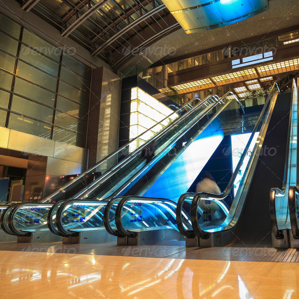 moving escalators in lobby at night - Stock Photo - Images