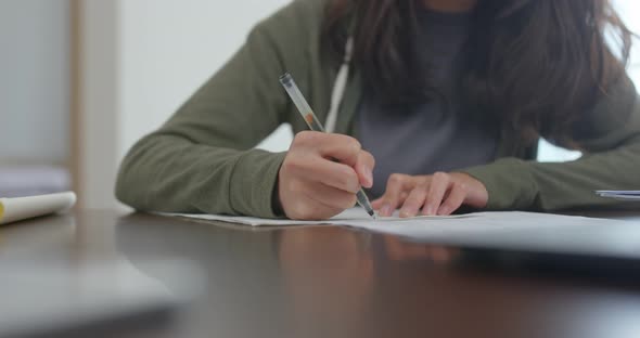 Woman study on the note at home alt