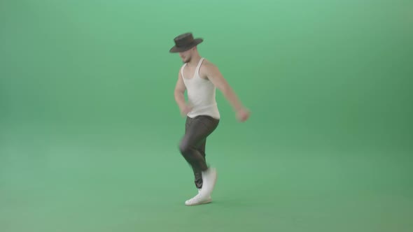 Sport Man In Black Hat Dancing And Marching Fast Isolated Over Green Screen   4 K Video Footage alt