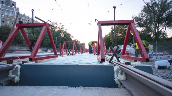 Tram Rails at the Stage of Their Installation and Integration Into Concrete Plates on the Road alt