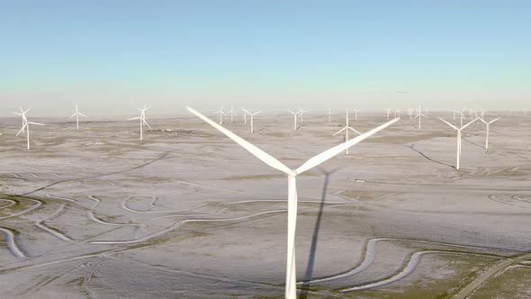Aerial shots of wind turbines on a cold winter afternoon in Calhan, Colorado alt