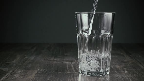 Clean Water Slowly Pours Into the Glass