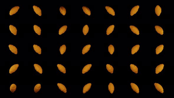 Croissants rotating on black background 4k