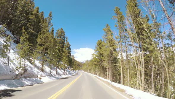 POV point of view -Driving through Rocky Mountain National Park in the Spring. alt