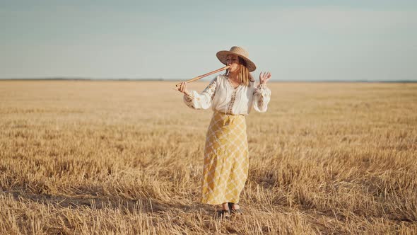 Woman Playing on Woodwind Wooden Flute  Ukrainian Telenka or Tylynka in Wheat Field alt