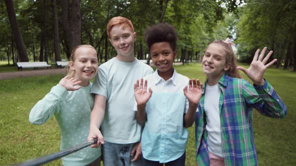 School Children Waving on Camera alt