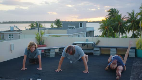 Cinematic Shot of Happy Smiling Family with Children Doing Exercises of Gymnastics Together at alt