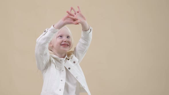 Portrait of Awesome Albino Kid with Blonde Hair. alt