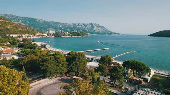 Aerial View Budva Beach By Sea with Sun Loungers and People Seashore Montenegro alt