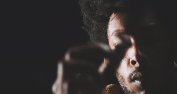 A man checking the wild mushroom’s quality and placing it in the glass container alt
