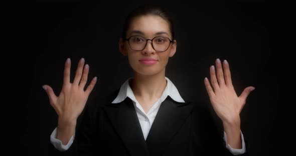 Business Woman with Glasses with a Serious Face Shows Ten Finger