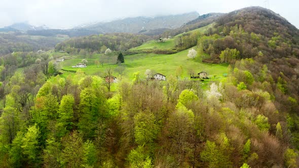Aerial Video of the Small Town of Pasturo in Lombardy North Italy Showing Mountain Panorama Forest alt