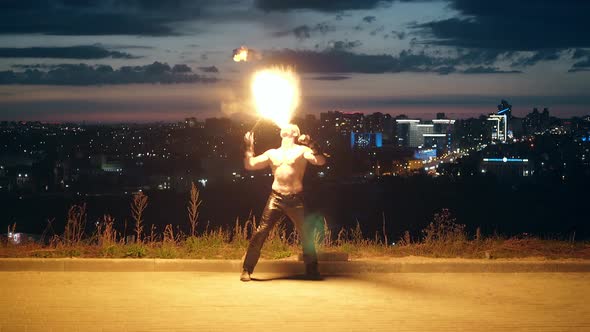 Young Blond Male Does Tricks with Fire, Male Breaths Fireballs Multiple Times alt