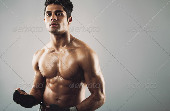 Hispanic male athlete with muscular physique - Stock Photo - Images