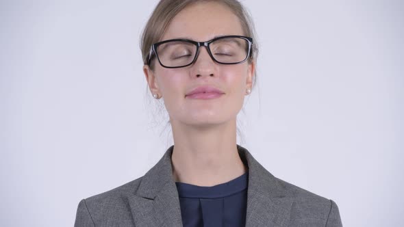 Face of Young Happy Businesswoman Relaxing with Eyes Closed alt