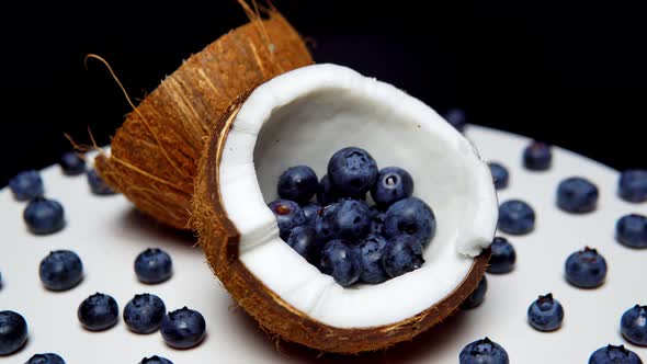 The Blueberry Inside of Halves of Coconut